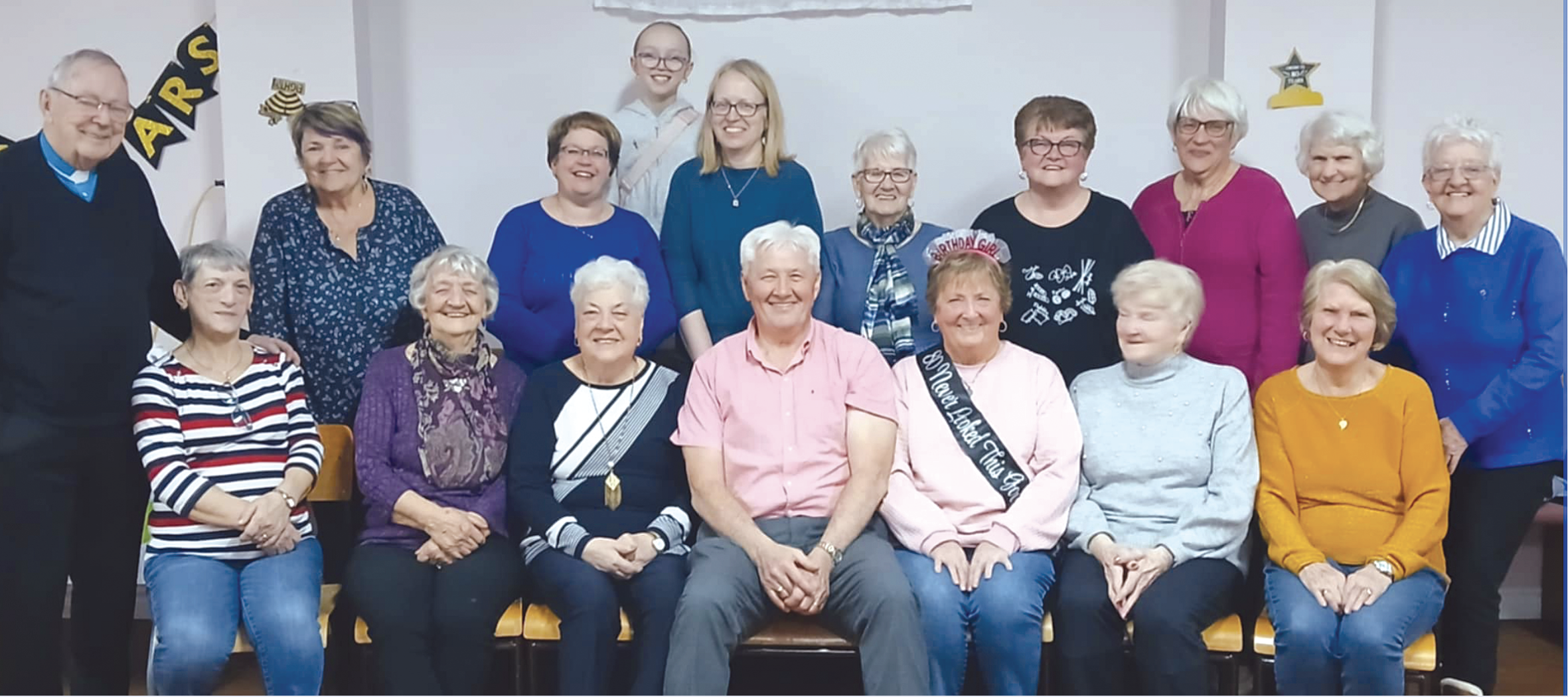 a group of women with two men, one a priest and one a visiting MHA who cam to speak about a recent trip to Uganda